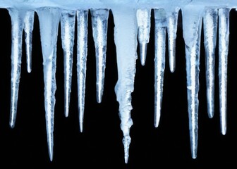 Icicles Hanging in Diagonal Line Against Black Background, Light Blue Color, Transparent Image