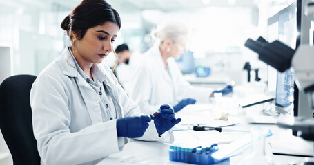 Woman, scientist and DNA test with blood sample for exam, medical discovery or clinic results at laboratory. Female person, doctor or research with RNA for analysis, cure or investigation at lab