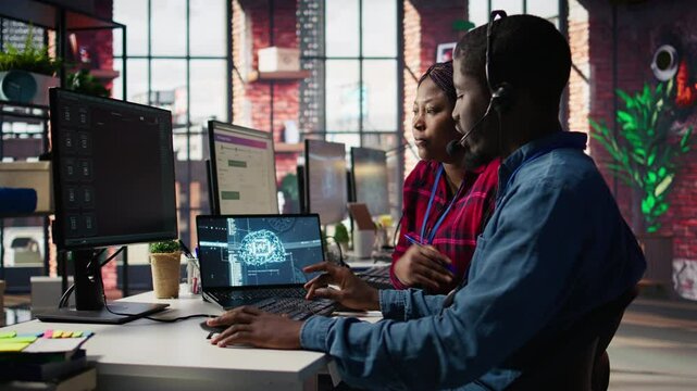 Call center manager teaching intern how to use AI to enhance customer interactions. Team leader in customer service office explaining trainee how to use artificial intelligence, camera B