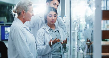 Glass wall, brainstorming and people in lab, research and collaboration for experiment. Science,...