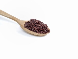 chocolate meshes in wooden spoon isolated on white background 