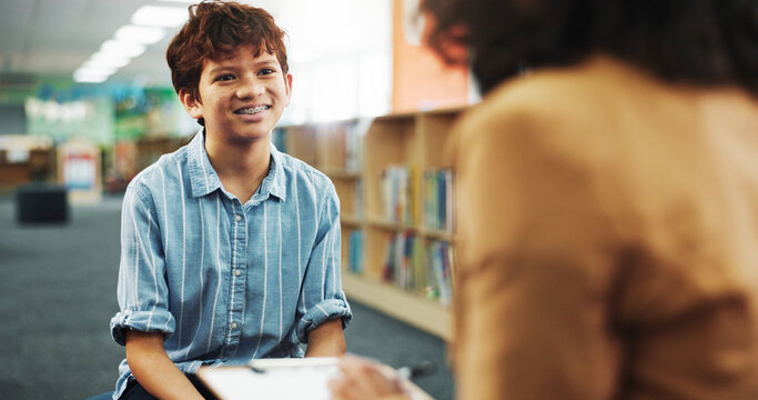 Talking, library and kid with school counsellor for future, development or career assessment. Discussion, education and therapist with boy student for behavior analysis at campus for growth.
