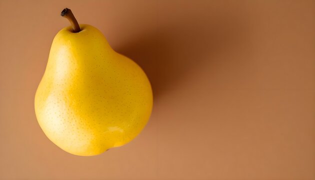 yellow pear sitting on top of a brown table
