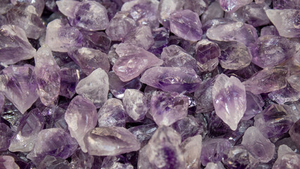 Amethyst mineral crystal pieces. Natural amethyst background.
