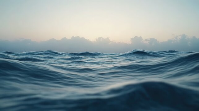 A serene seascape featuring gently rolling ocean waves, captured in soft, fluid motion.