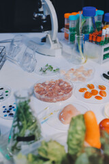 Team Asian scientists in a lab conducting food research using a microscope and lab equipment, showcasing innovation in food science and biotechnology