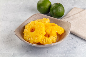Sweet canned pineapple slices in syrope