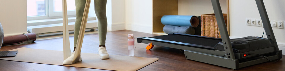 Engaging in workout with various gym equipment in contemporary home setting creating active lifestyle environment