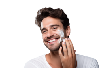 A man with dark hair and white shirt is applying shaving cream and smiling on a  on transparent background png