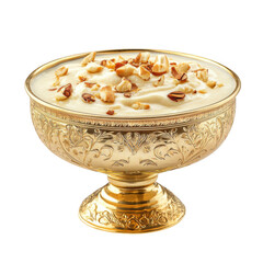 A golden bowl filled with creamy dessert topped with nuts on a black background studio shot