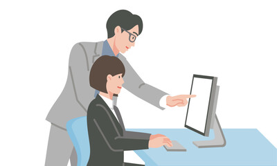 パソコンの前で打ち合わせする男女