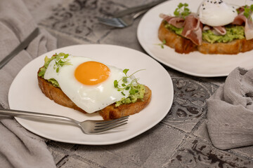 Toast with avocado and fried egg