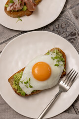 Toast with avocado and fried egg