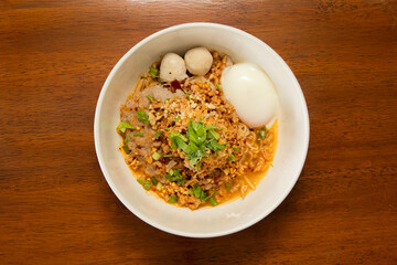 Cooking delicious noodle dish kitchen food photography warm atmosphere close-up culinary delight