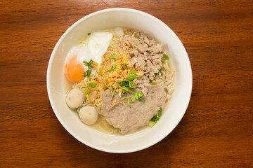Indoor delight close-up of flavorful noodle soup with asian culinary toppings