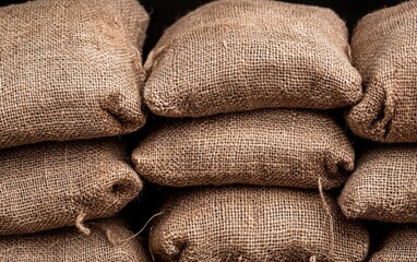 Stacked Burlap Sacks Dark Background