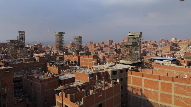 Flying Towards The Manshiyat Naser With Pile Of Garbage In Cairo, Egypt. - aerial shot