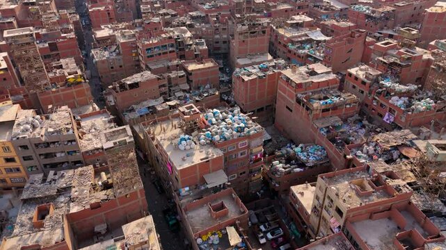 Pile Of Garbage Bags On The Rooftop Of Slum Buildings In Manshiyat Naser, Egypt. - aerial shot
