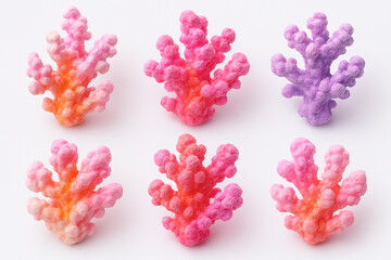 Obraz premium Colorful artificial coral decorations in different shades arranged on a light background for aquatic-themed displays
