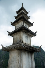 Fototapeta premium A close-up of the stone pagoda at the summit of the Mua Caves viewpoint in Ninh Bình, Vietnam on December 26, 2019