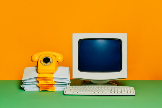 Vintage 80s personal computer setup with CRT monitor and dial phone