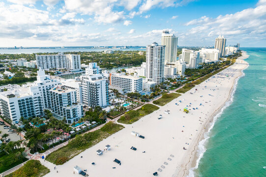 Miami Beach, Florida &ndash; Elevated aerial shows resort hotels and high-rise condominiums lining the white sand beach along the turquoise ocean.