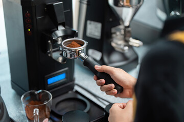 Coffee Grinding and Precision Measurement. A skilled barista measuring coffee grounds with precision.