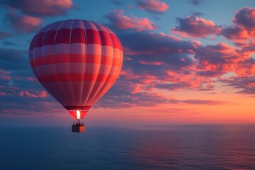 Fototapeta premium Sunrise hot air balloon over calm ocean
