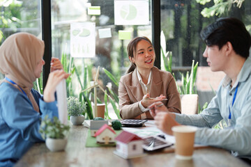 Empowering Sustainable Practices. A team discusses sustainable architecture and renewable energy solutions.