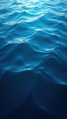 Obraz premium Dark blue ocean surface with ripples from a school of fish, ripples, ocean