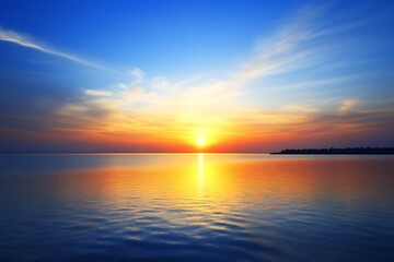 Fototapeta premium Majestic sunset over the ocean with warm colors blending into the horizon creating a dreamy scene