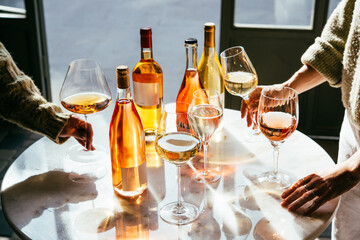 Different types of wine in glasses - red, white, rose and amber. Wine tasting in a bar or restaurant.
