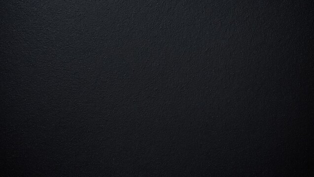 Seamless texture of black sponge foam as a background, ethylene vinyl acetate material, fine sandpaper-like quality.