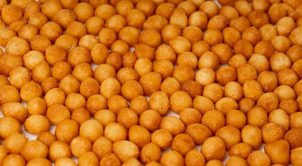 Small pastry balls, fried crispy wheat soup pearls, salad egg puffs or choux pastry