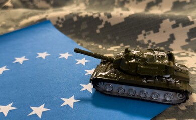 toy tank on the background of the EU flag