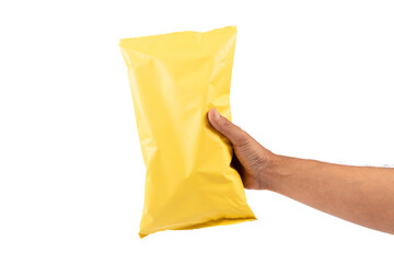 Male hand holding a yellow potato chips package mockup isolated no background