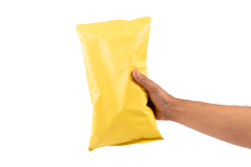 Male hand holding a yellow potato chips package mockup isolated no background