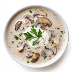 A bowl of creamy mushroom soup, with saut&Atilde;&copy;ed mushrooms, onions, garlic, and thyme, blended until smooth and creamy, topped with a swirl of coconut cream and fresh parsley, isolated on clean white