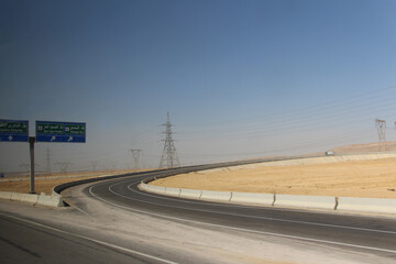 Fototapeta premium Desert scenery with the transmission tower on the road trip from Hurghada to Cairo, Egypt