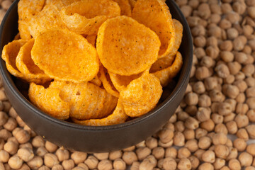 Hummus chickpea chips, chick pea crisps pile, healthy orange snack, fried legume crunchies