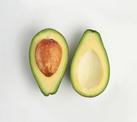 Fresh avocado slices on a white background. Top view.