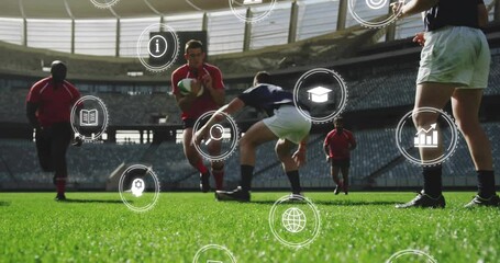 On field, rugby players tackling with animation of digital icons overlaying scene - Powered by Adobe