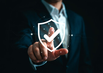 Cybersecurity Concept - Shield with Checkmark Overlaid on Business Professional