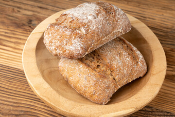 Brown rye bun, square gluten free bread, whole grain healthy breakfast bread