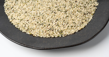 Shelled hemp seeds pile, peeled cannabis grains, marijuana kernels without peel
