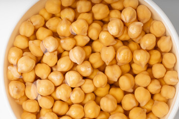 Soaked chickpeas, chick pea in water, swollen wet Cicer arietinum fruits, garbanzo beans cooking