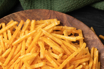 Fried chips sticks, finger potato chips, golden shoestring fries pile, French fries