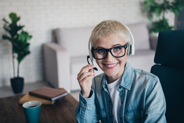 Smiling Professional Woman Working Online in a Modern Home Office Setting