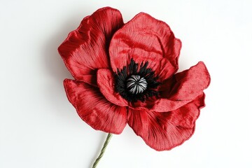 A meticulously crafted red poppy flower, showcasing intricate textile details and lifelike realism.