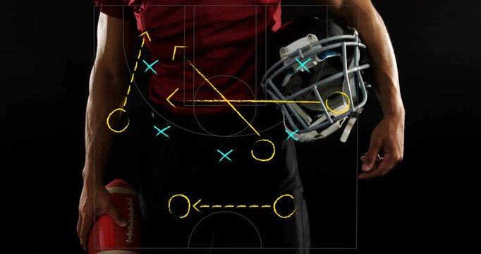Holding helmet and ball, football player studying animation of strategy diagram